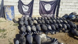 Weapons and explosives confiscated by Iraqi security forces from Islamic State militants are on display at an Iraqi army base as security forces advance their position in northern Ramadi, 70 miles (115 kilometers) west of Baghdad, Iraq.