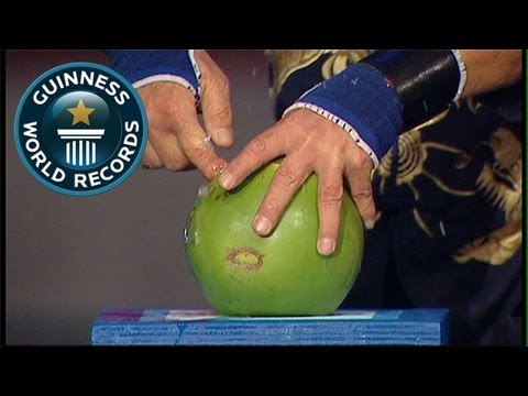 Fastest time to pierce 4 coconuts with 1 FINGER! - Guinness World Records Classics