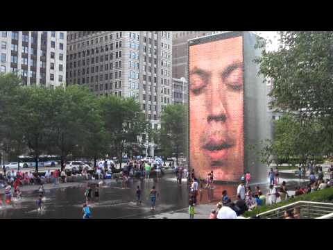 Wading in Millennium Park's Crown Fountain by Jaume Plensa