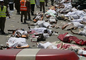 In this Thursday, Sept. 24, 2015, file photo, bodies of people who died in a crush in Mina, Saudi Arabia during the annual hajj pilgrimage lie in a street. The September stampede during the hajj in Saudi Arabia killed over 2,400 pilgrims, a new Associated Press count shows.