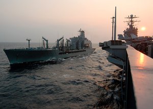 Atlantic Ocean (Aug. 26, 2003) -- USS George Washington (CVN 73) comes along-side the Military Sealift Command (MSC) oiler USNS Kanawha (T-AO 196) for a replenishment at sea. The Norfolk, Va.-based aircraft carrier is conducting flight deck qualifications in the Atlantic Ocean.