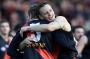 Greatest comeback: James Hird and John Barnes embrace after the Bombers' amazing turnaround in round 16, 2001