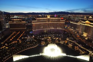 The Fountains at night, as seen from Paris Las Vegas .The fountains are set in a 9-acre (3.6 ha) man made lake. Contrary to urban myth, the lake is not filled with treated Grey water from the hotel.