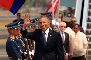 File - U.S. President Barack Obama waves upon arrival in Manila, Philippines, on April 28, 2014.