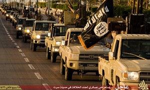 An Islamic State propaganda image made available by Islamist media outlet Welayat Tarablos on February 18, 2015, allegedly shows members of the Islamic State (IS) militant group parading in a street in Libya's coastal city of Sirte, which lies 500 kilometres (310 miles) east of the capital, Tripoli. Egyptian F-16s bombed militant bases in the eastern Libyan city of Derna in mid-February after the Islamic State group in Libya released a gruesome video showing the beheadings of a group of Egyptian Coptic Christians who had gone to the North African country seeking work.