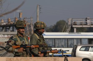 Indian army soldiers take positions outside the Indian airbase in Pathankot, 430 kilometers (267 miles) north of New Delhi, India, Saturday, Jan. 2, 2016.