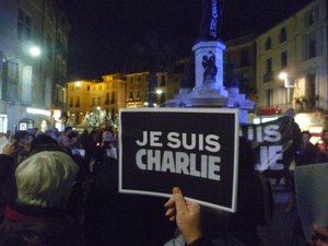 Citizens gather to pay tribute to victims of the terrorist attack against the French satirical weekly Charlie Hebdo, Friday, Jan. 9, 2015, Pezenas, France.