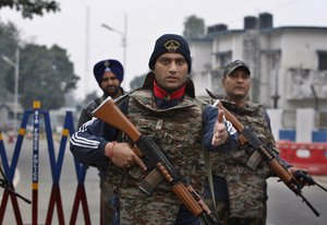 Indian soldiers stand guard at the airbase in Pathankot, India, Monday, Jan. 4, 2016.