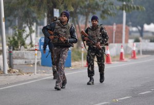 Indian security forces patrol inside the Indian air force base in Pathankot, India, Sunday, Jan. 3, 2016.