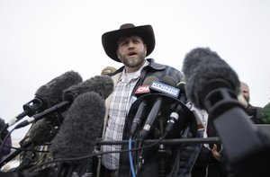 Ammon Bundy, one of the sons of Nevada rancher Cliven Bundy, speaks with reporters during a news conference at Malheur National Wildlife Refuge headquarters Monday, Jan. 4, 2016, near Burns, Ore.