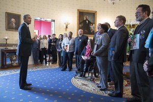 In the Blue Room of the White House, President Barack Obama talks with people whose lives have been impacted by gun violence, prior to announcing executive actions that the administration is taking to reduce gun violence, Jan. 5, 2016.