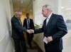 Senate Minority Leader Harry Reid of Nev., left, shakes hands with Senate Minority Whip Richard Durbin of Ill.,, right, after speaking with reporters following the Senate vote on the Iran nuclear agreement on Capitol Hill in Washington, Thursday, Sept. 10, 2015.