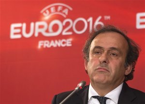 UEFA President and former French soccer star Michel Platini listens to a reporter during a press conference after a meeting on the preparartions for the European Championship 2016 in France at the headquarters of the French Football Federation in Paris, Tuesday, Oct. 23, 2012.