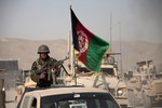 File - An Afghan National Army soldier leaves for a partnered patrol with U.S. Marines with Golf Company, 2nd Battalion, 7th Marine Regiment, Regimental Combat Team 7 at Forward Operating Base Sabit Qadam, Helmand province, Afghanistan, Nov. 14, 2012.