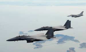 ROKAF F-15K strike fighters. From time to time, South Korea has sent its troops overseas to assist American forces.