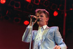 File: Rock star David Bowie performs on stage at Wembley Stadium, London, July 13, 1985, during the Live Aid famine relief rock concert.