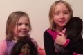 Nachman asks her daughters what they like about their new dolls.