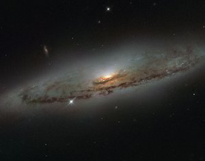 File - This NASA/ESA Hubble Space Telescope image shows the spiral galaxy NGC 4845, located over 65 million light-years away in the constellation of Virgo (The Virgin).