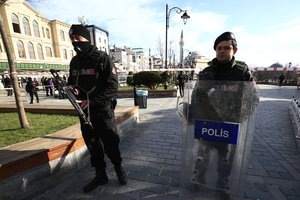 Policemen secure an area at the historic Sultanahmet district, which is popular with tourists, after an explosion in Istanbul, Tuesday, Jan. 12, 2016.