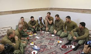 This picture released by the Iranian Revolutionary Guards on Wednesday, Jan. 13, 2016, shows detained American Navy sailors in an undisclosed location in Iran.