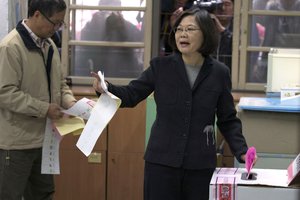 Taiwan's Democratic Progressive Party (DPP) presidential candidate Tsai Ing-wen prepares to cast her vote at a polling station for the presidential election in Taipei, Taiwan, Saturday, Jan. 16, 2016.