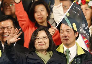 Taiwan's Democratic Progressive Party, DPP, presidential candidate Tsai Ing-wen waves as she celebrates winning the presidential election Saturday, Jan. 16, 2016, in Taipei, Taiwan.