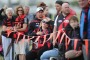 Standing by their club: Essendon fans on Thursday during the first Bombers training session since the CAS verdict was announced on Tuesday.