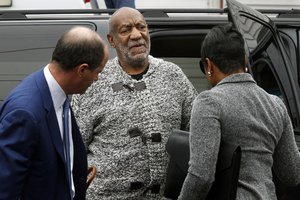 File - Actor and comedian Bill Cosby is helped as he arrives for a court appearance, Wednesday, Dec. 30, 2015, in Elkins Park, Pa.