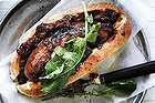 Adam Liaw's perfect barbecued sausage in a bun.