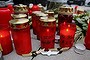 Burning candles and pins of German airlines Condor, Germanwings and Lufthansa are placed by crew members in commemoration of the victims of Germanwings flight 4U9525 outside the Germanwings headquarters at Cologne-Bonn airport.