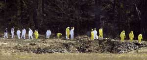 The Flight 93 crater later in the morning. Notice the destruction of the airplane is nearly total.