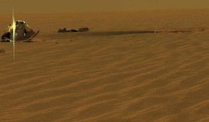 File - This image from 2005 shows the remains of the heat shield from NASA's Mars Exploration Rover Opportunity, broken into two key pieces, the main piece on the left side and a broken-off flank piece near the middle of the image. T