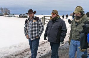 Ammon Bundy, left, approaches an FBI gate at the Burns Municipal Airport in Oregon on Friday, Jan. 22, 2016. Bundy is the leader of an armed group occupying a national wildlife refuge to protest federal land policies.