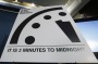 A sign showing the 'Doomsday Clock' that remains at three minutes to midnight is seen after it was unveiled by the Bulletin of the Atomic Scientists on Tuesday. 