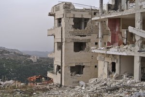 A view of destroyed buildings in Salma, Syria, Friday, Jan. 22, 2016. Syrian government forces relying on Russian air cover have recently seized Salma, located in Syria's province of Lattakia, from militants. The Syrian government offensive has given Assad a stronger hand going into peace talks with the opposition that are planned for next week in Switzerland. (AP Photo/Vladimir Isachenkov)