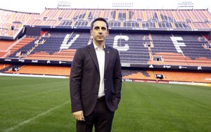 Former Manchester United and England defender Gary Neville poses to the photographers in the Mestalla stadium after a press conference in Valencia, Spain , Thursday, Dec. 3, 2015.