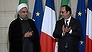 Iranian President Hassan Rouhani, left, and French President Francois Hollande applaud during a bilateral agreements session, at the Elysee Palace, in Paris, Thursday, Jan. 28, 2016. Iran Air has signed a deal to buy 118 aircraft from Airbus in the first of an expected host of commercial deals expected to be announced during the visit of Iranian President Hassan Rouhani to Paris. (Stephane de Sakutin, Pool photo via AP)