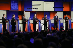 Republican presidential candidate Ohio Gov. John Kasich, right, answers a question as (L-R) Sen. Rand Paul, R-Ky., New Jersey Gov. Chris Christie, retired neurosurgeon Ben Carson, Sen. Ted Cruz, R-Texas, Sen. Marco Rubio, R-Fla., and former Florida Gov. Jeb Bush listen during a Republican presidential primary debate, Thursday, Jan. 28, 2016, in Des Moines, Iowa. (AP Photo/Charlie Neibergall)