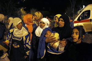 FILE - In this Monday, Jan. 11, 2016 file photo, people wait to leave the besieged town of Madaya, northwest of Damascus, Syria, where Doctors Without Borders says dozens of people have died of starvation since September.