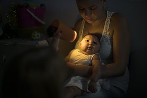 Gleyse Kelly da Silva holds her daughter Maria Giovanna, who was born with microcephaly, as she undergoes visual exams at the Altino Ventura foundation in Recife, Brazil, Thursday, Jan. 28, 2016.