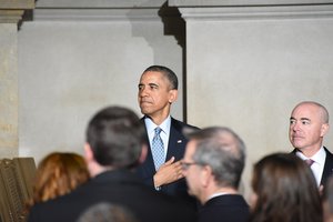 President Barrack Obama along with Deputy Secretary of Homeland Security Alejandro Mayorkas delivers remarks at a naturalization ceremony at the National Archives in Washington, D.C., Dec. 15, 2015.