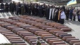 Orthodox priests and Ukrainians attend a mass funeral ceremony at the Lychakiv Cemetery in Lviv on February 3.