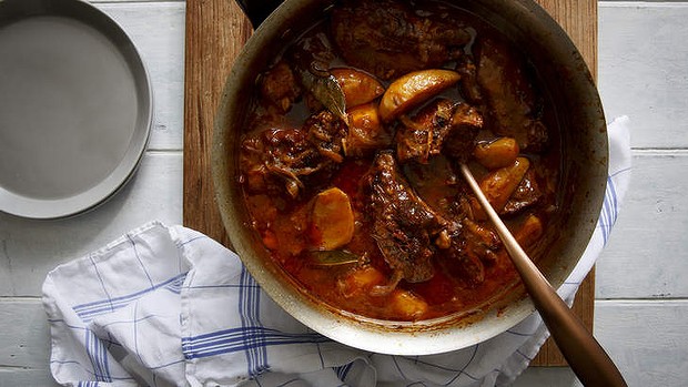 Braised lamb neck with white wine, tomato and oregano.