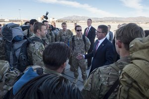 Defense Secretary Ash Carter greets troops returning from a deployment to Djibouti while visiting Nellis Air Force Base, Nev., Feb. 4, 2016.