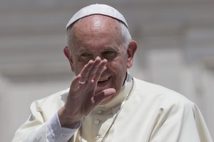 Pope Francis waves as he leaves at the end of his weekly general audience, in St. Peter's Square at the Vatican, Wednesday, June 17, 2015.