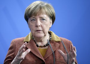 German Chancellor Angela Merkel gestures during a joint press conference with the Prime Minister of Portugal, Antonio Costa, as part of a meeting at the chancellery in Berlin, Germany, Friday, Feb. 5, 2016.