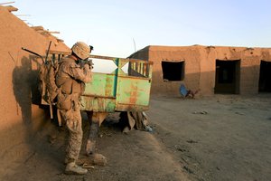 File - U.S. Marine Lance Cpl. Daniel Keeler, a team leader with 3d Platoon, Bravo Company, 1st Battalion, 2d Marine Regiment, observes his surroundings during a security patrol in Nad Ali, Helmand Province, Afghanistan, on Oct. 7, 2014.