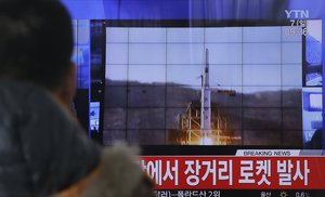 A South Korean man watches a TV news program with a file footage about North Korea's rocket launch at Seoul Railway Station in Seoul, South Korea, Sunday, Feb. 7, 2016.