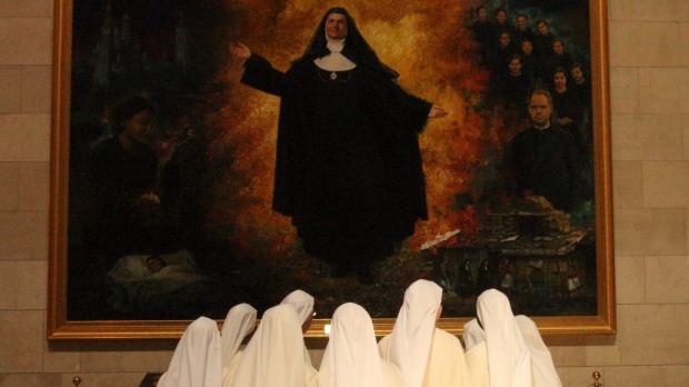 On our first day in Madrid, we paid a visit to Catederal de la Almudena and noticed a group of nuns entering just before us. I followed them surreptitiously for a while inside the stunning cathedral and snapped this as they paid respects to one of their religious heroines.