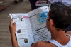 Yangon is a special place. Few tourists and a city that is still very much emerging from its past, life could easily be 40 - 50 years ago.

This photo shows a very typical scene of a local stall holder stopped in the middle of the day reading his paper waiting for business.